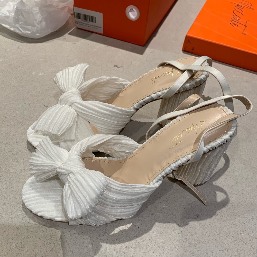 Brand new (never used) white high heels size 7
